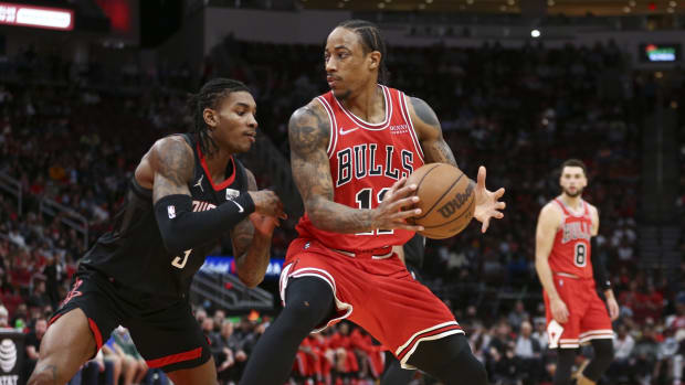 Nov 24, 2021; Houston, Texas, USA; Chicago Bulls forward DeMar DeRozan (11) controls the ball as Houston Rockets guard Kevin Porter Jr. (3) defends during the second quarter at Toyota Center. Mandatory Credit: Troy Taormina-USA TODAY Sports